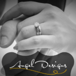Image of couple holding hands. Picture features their wedding rings.